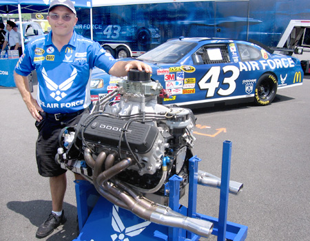 Lloyd Graham displays the 850-hp Dodge engine that powers Air Force No. 43.